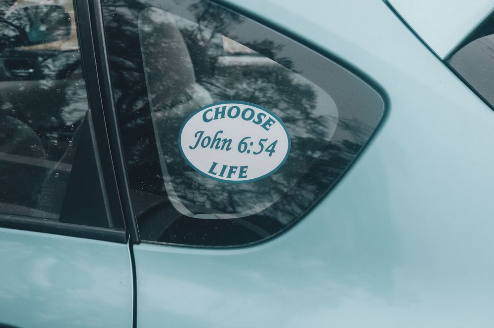 blue car with white and black license plate