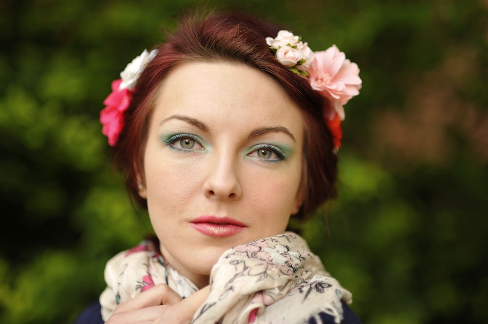 woman in white and pink floral hijab