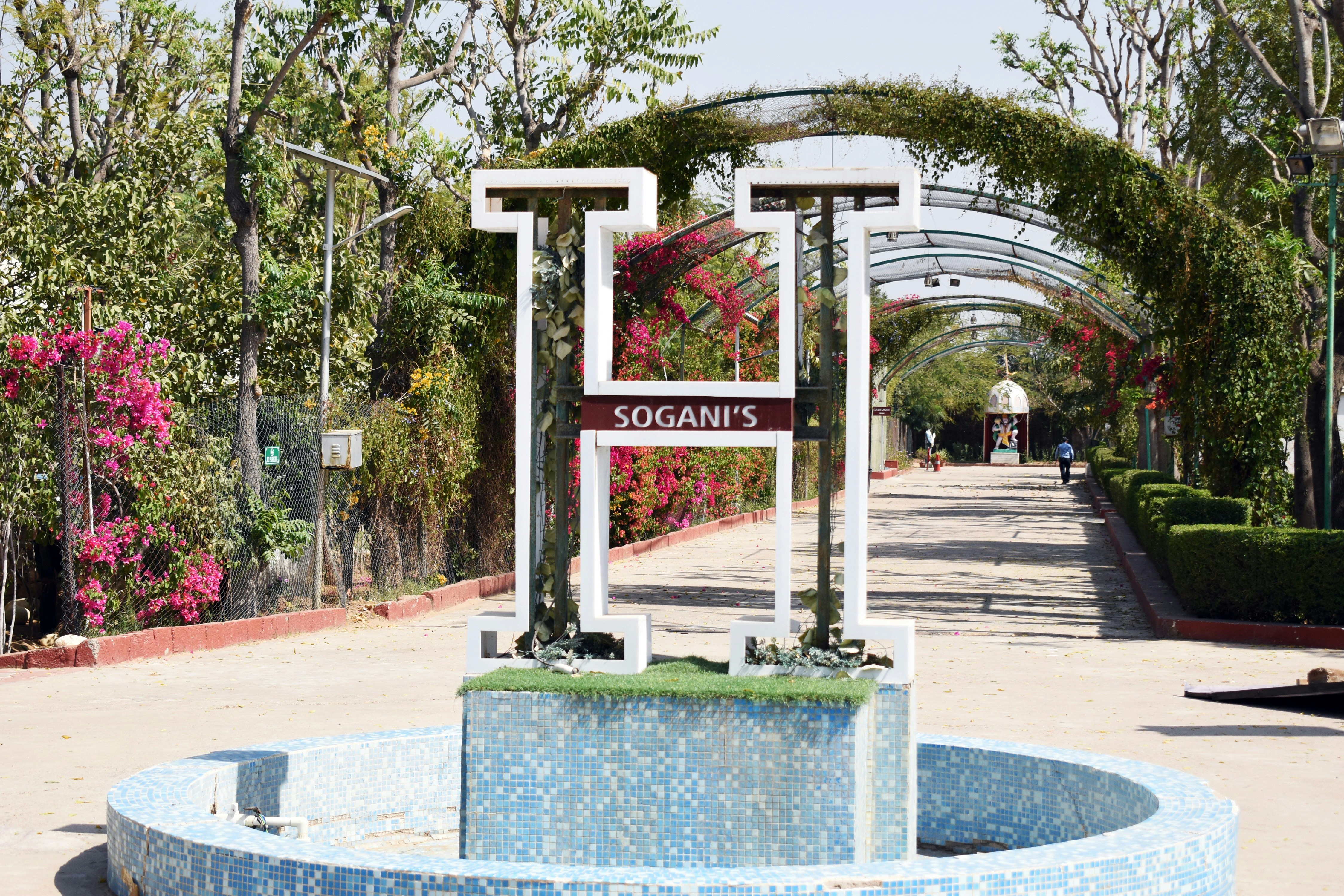 brown wooden signage on gray concrete bench