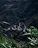 A scenic shot of a winding road through lush green mountains, inviting adventure.