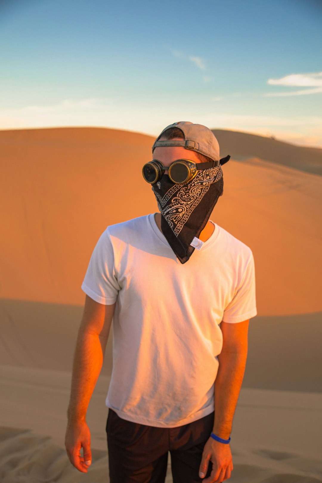 man in white crew neck t-shirt wearing black and gold mask