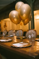 gold balloons on brown wooden table