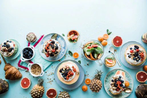 assorted fruits on white ceramic bowls