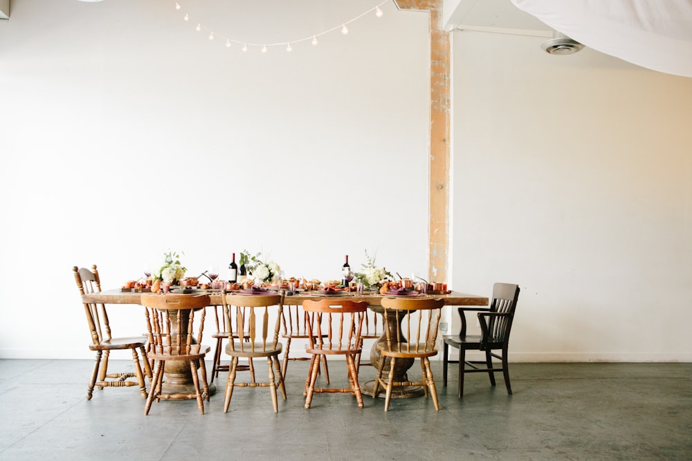 brown wooden table with chairs