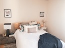 white bed linen on bed