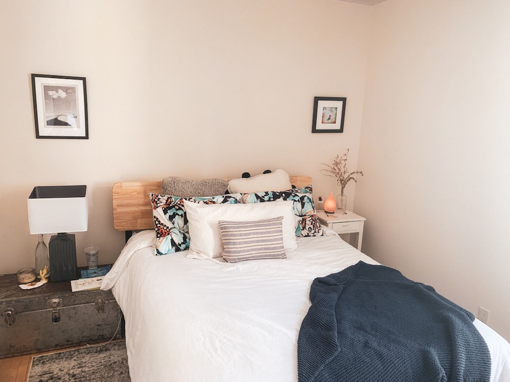 white bed linen on bed