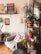 A bright living room corner styled with plants and handmade crafts.