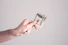 person holding 1 us dollar bill