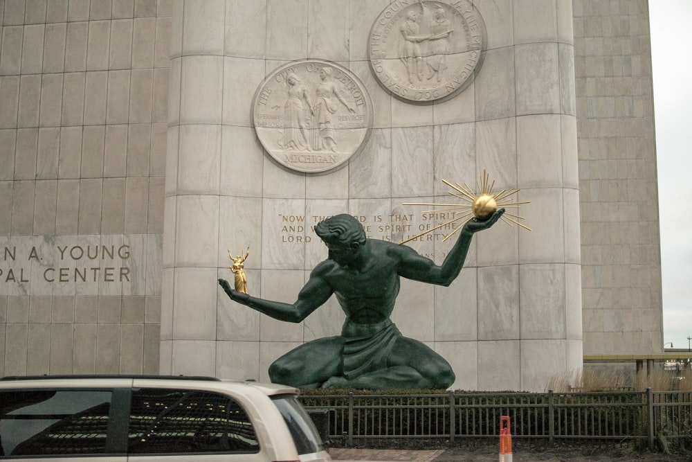 man in black suit statue