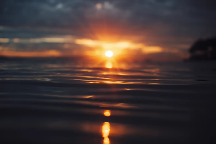 Sunset over the ocean off Copacabana Beach, Rio de Janeiro, Brazil