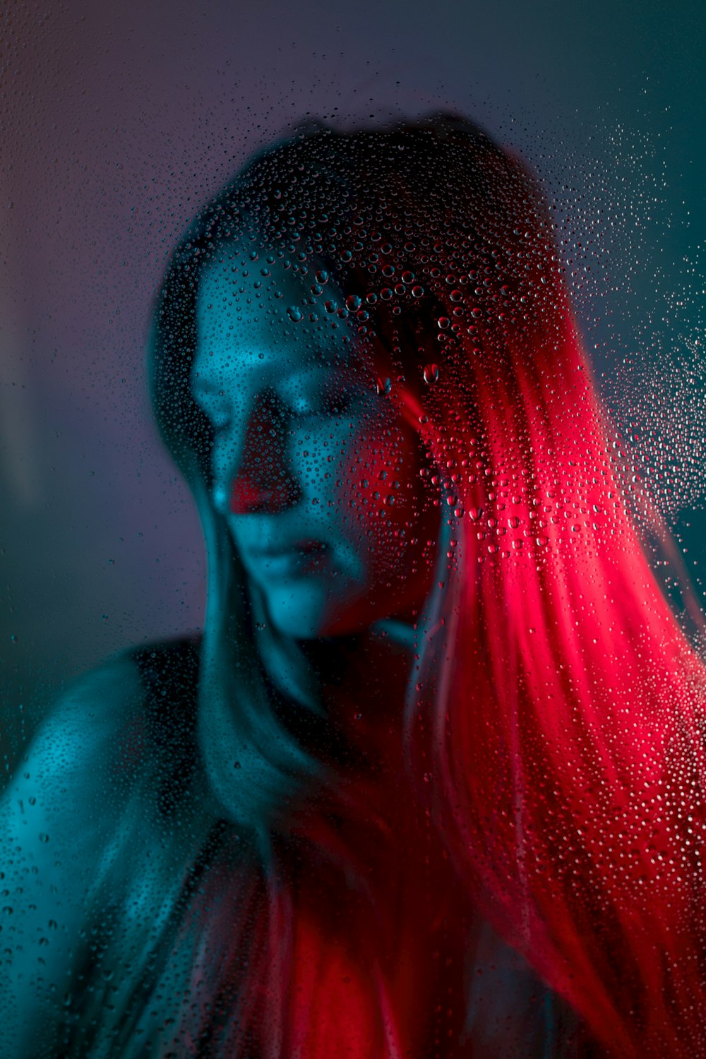 woman with red hair in blue shirt