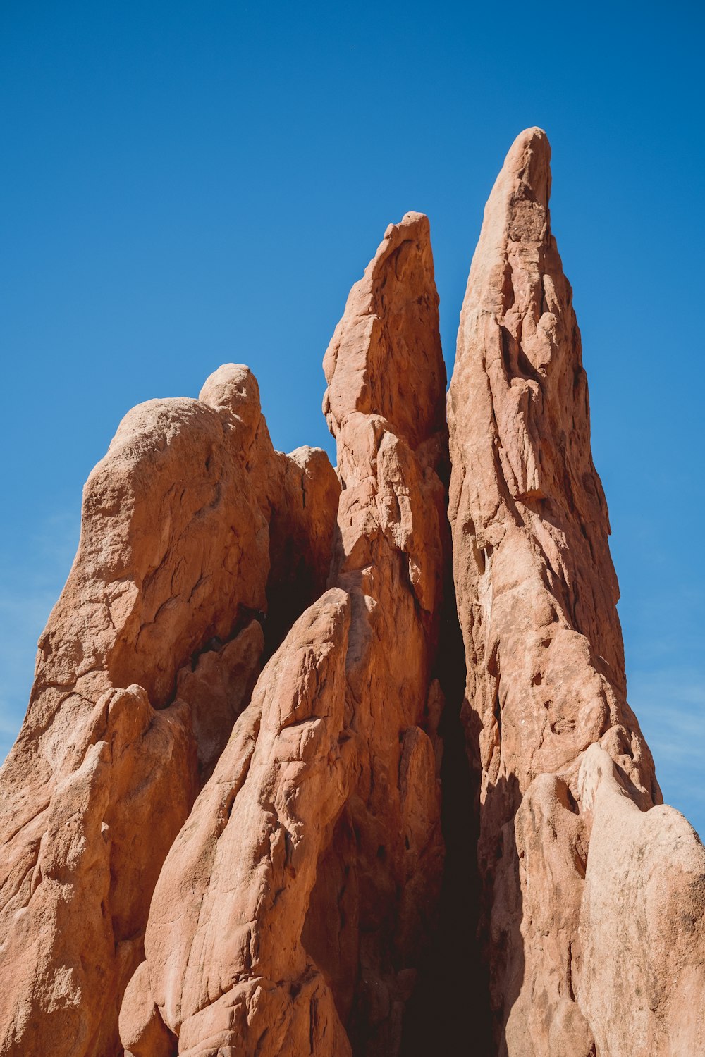 brown rock formation under blue sky during daytime