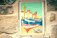 A vibrant mural of local fishermen decorating the restaurant's seaside wall.