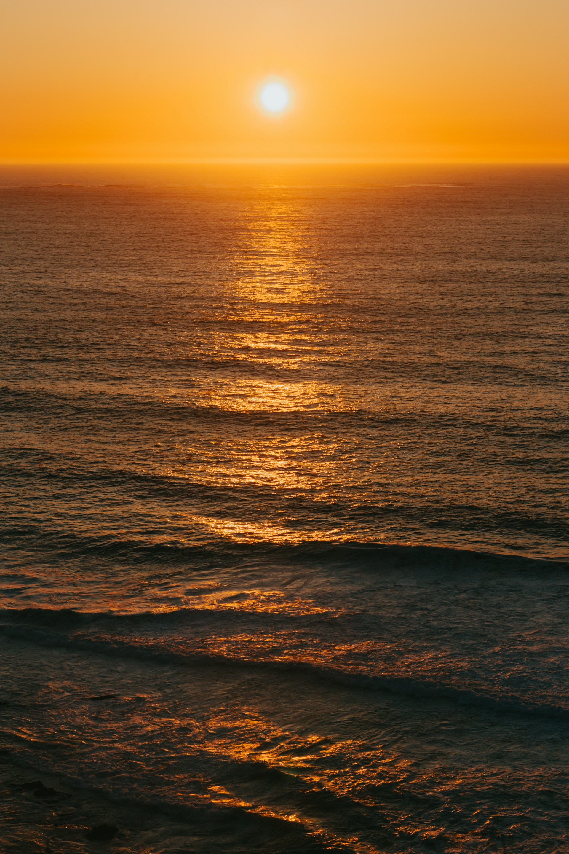 body of water during sunset