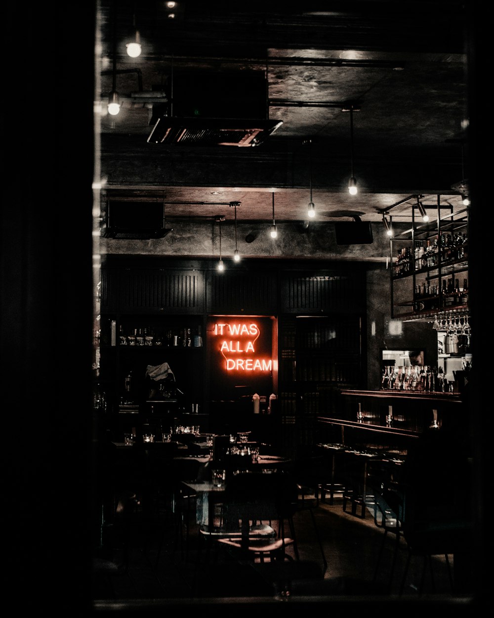 restaurant with red and white neon sign