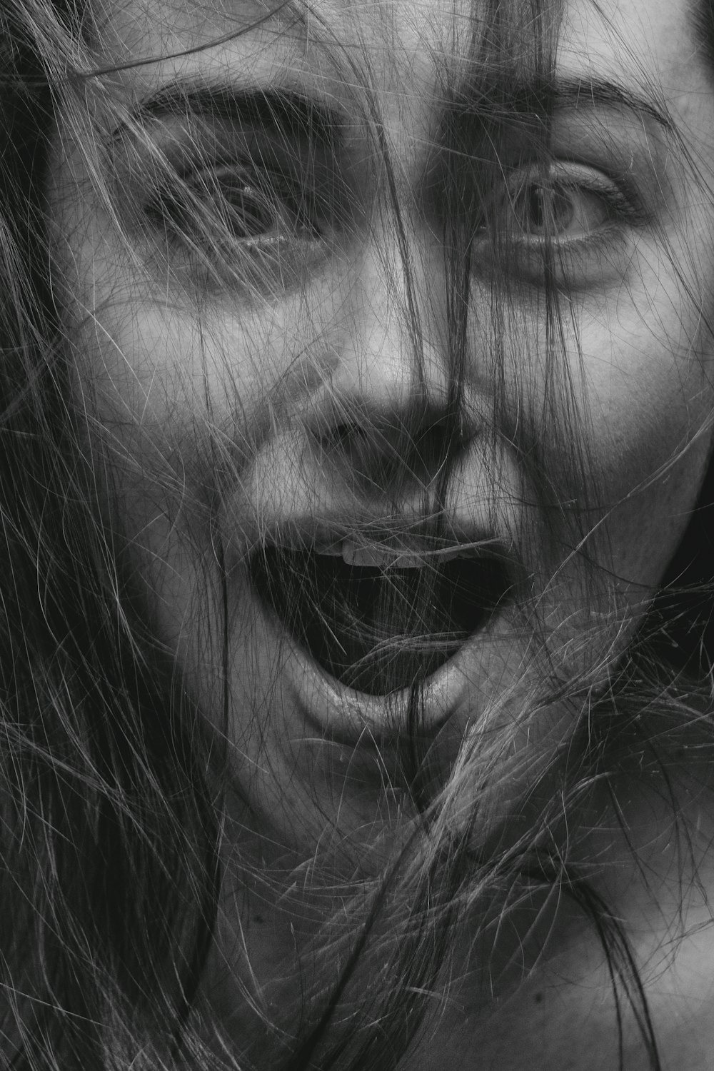 grayscale photo of womans face