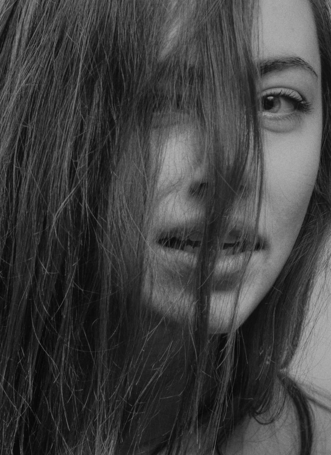 womans face grayscale photo