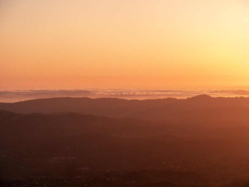 silhouette of mountains during sunset