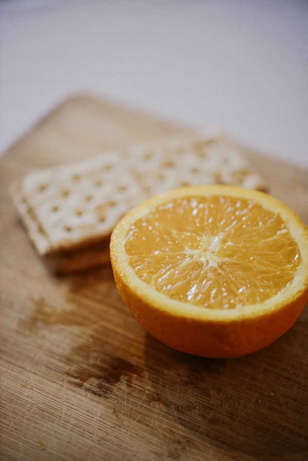 Sliced orange fruit on brown wooden table