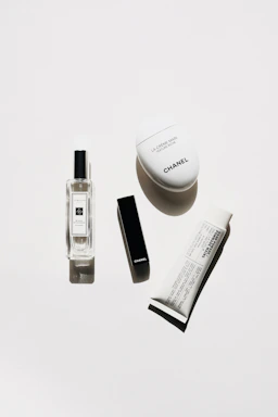 Flat lay of premium skincare jars and creams with black and gold packaging