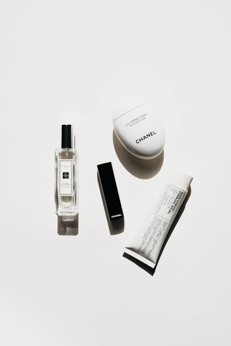 Flat lay of premium skincare jars and creams with black and gold packaging
