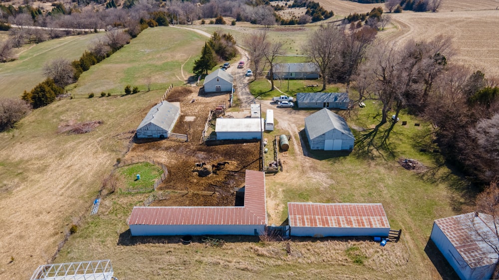 an aerial view of a farm with several barns