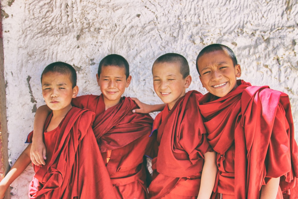 3 men in red robe