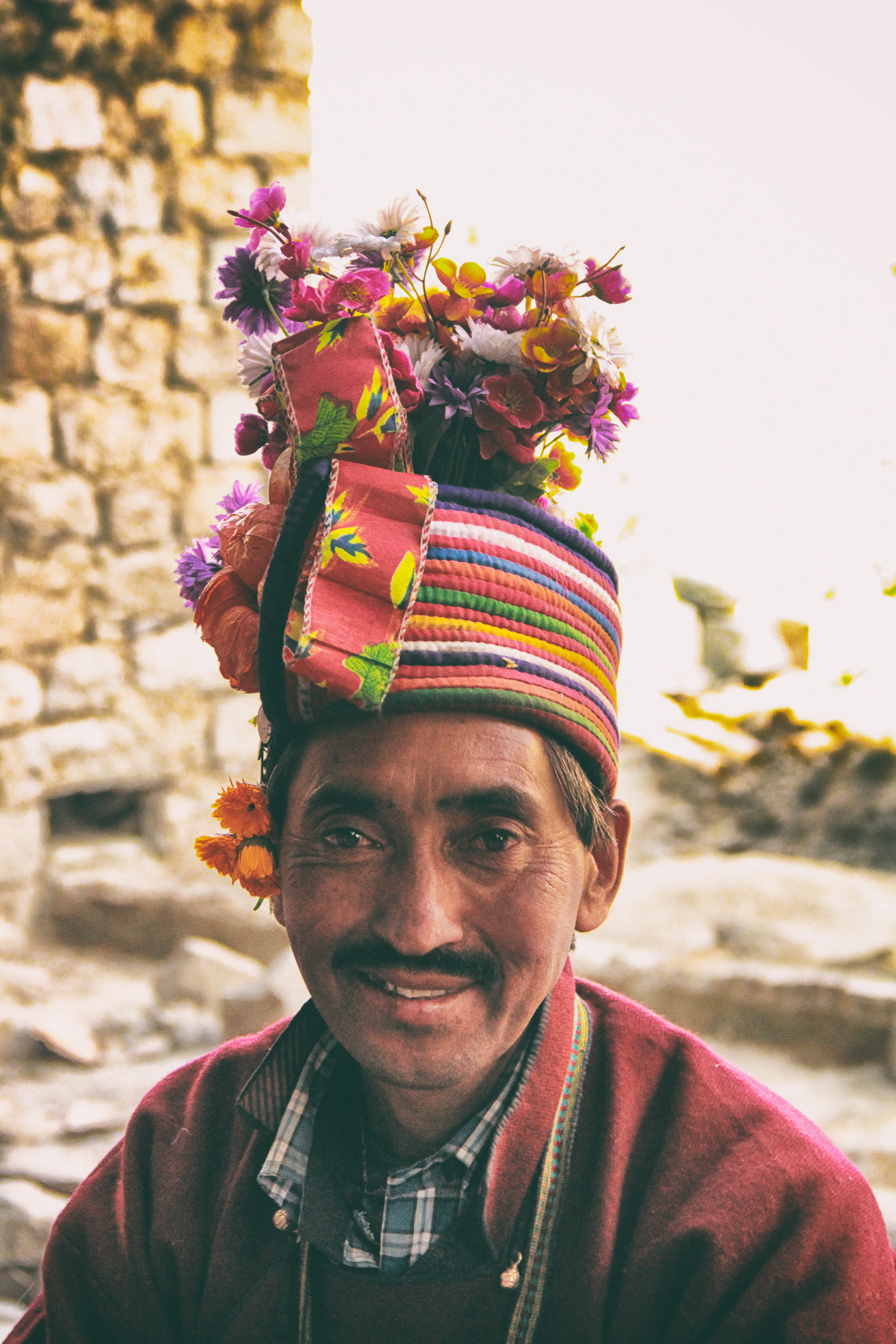 Portrait of a man in a red and white scarf