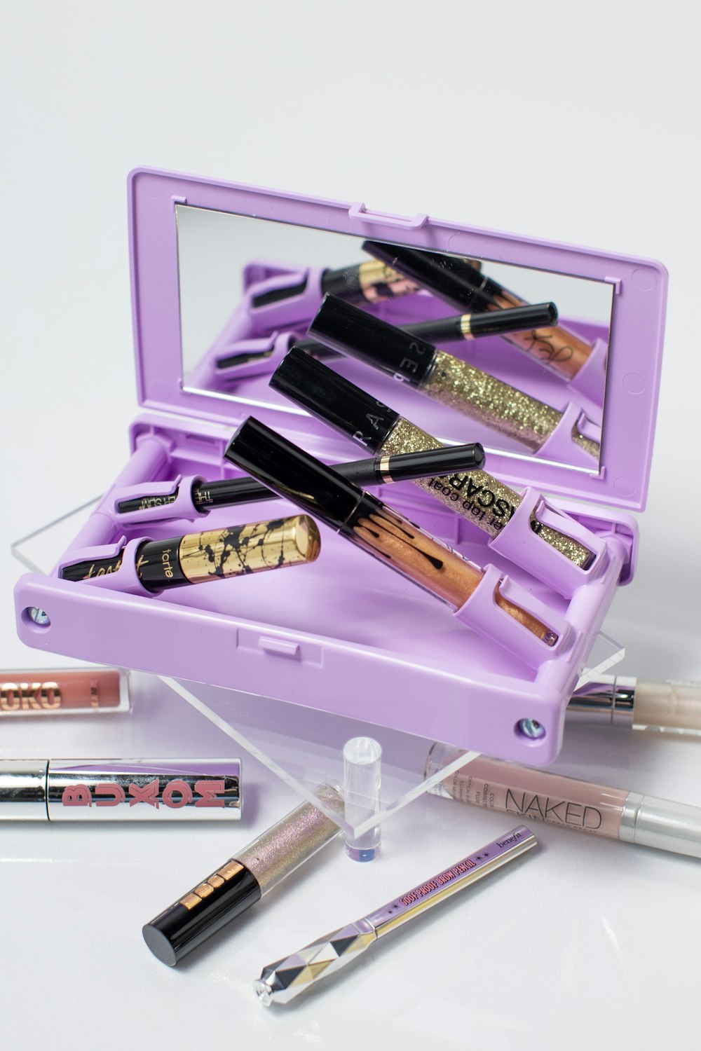 black and purple lipstick in box
