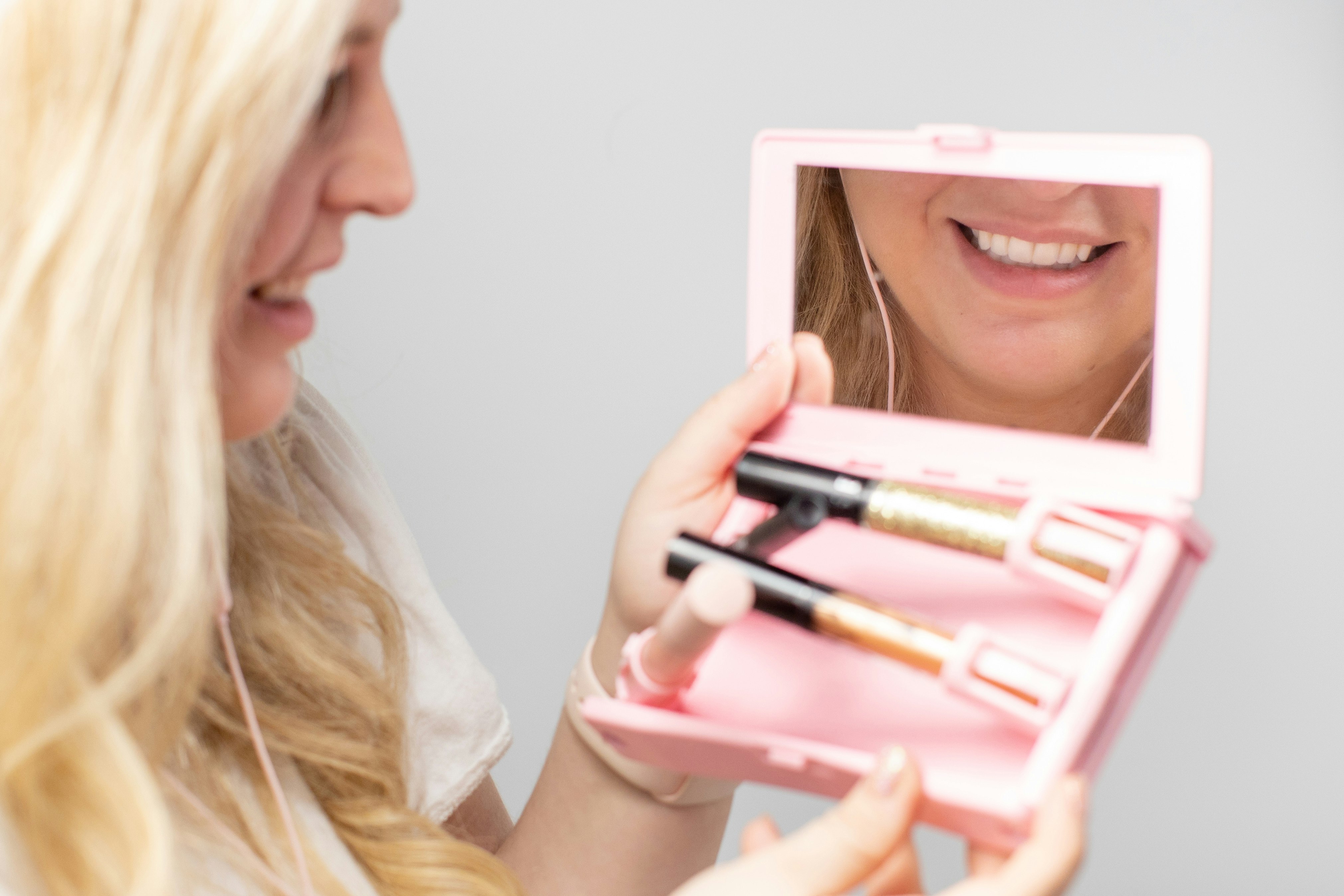 woman holding white and pink box