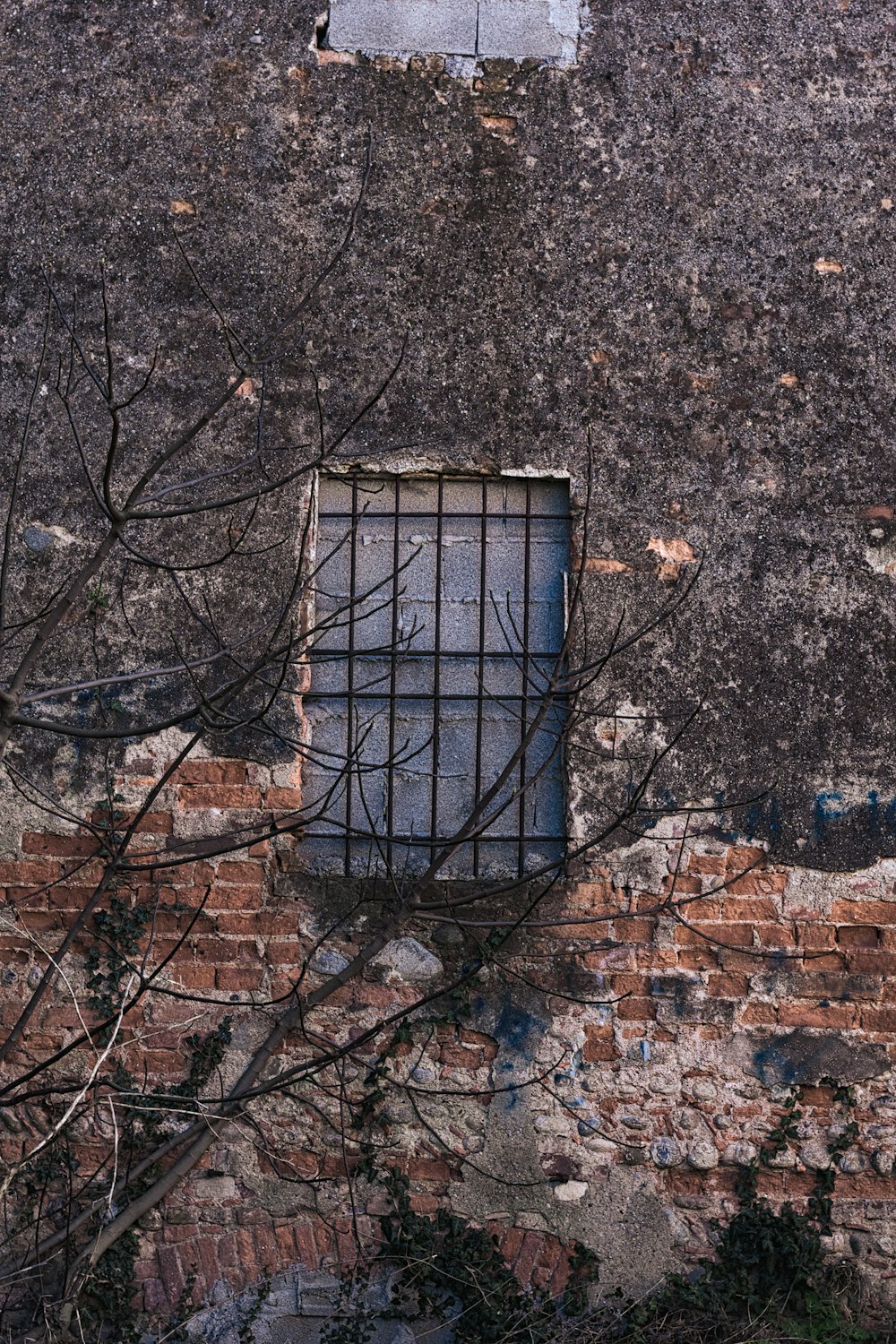 black metal frame on brown brick wall