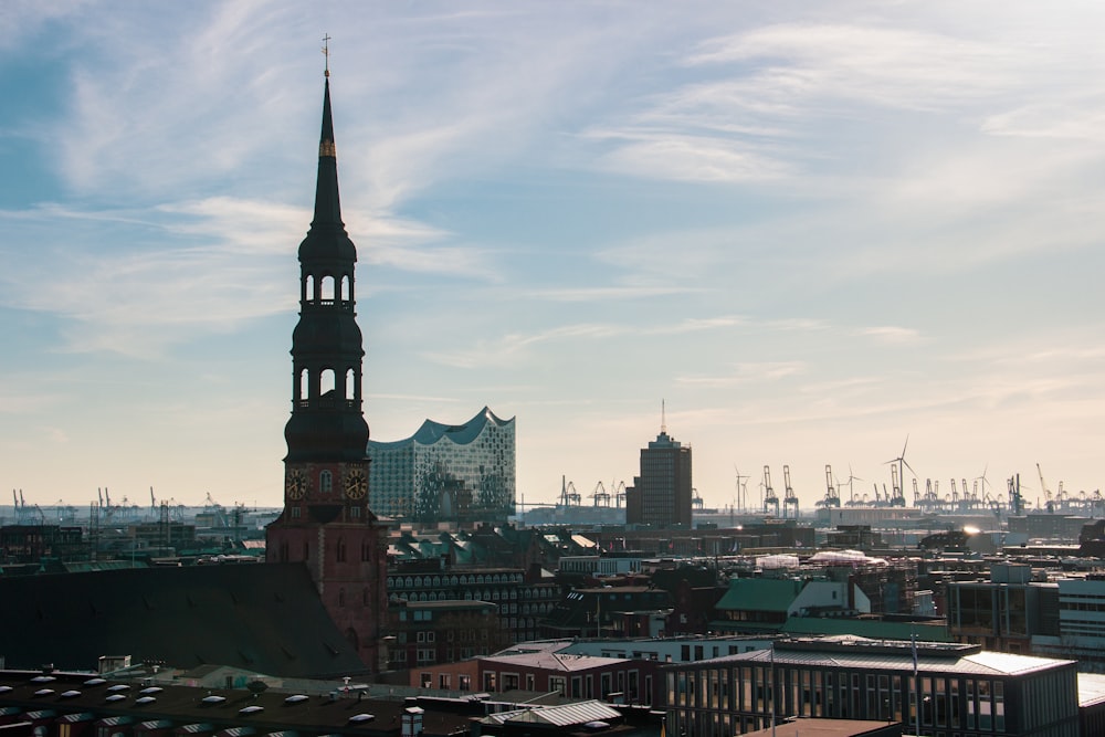 city skyline under white cloudy sky during daytime