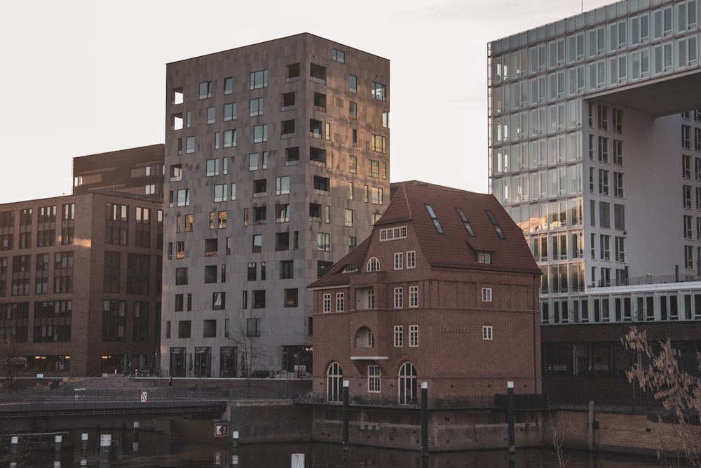 brown concrete building near body of water during daytime