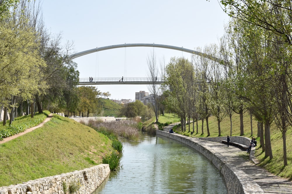 gray concrete bridge over river