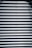 Corrugated metal sheet with horizontal ridges and bolts aligned vertically in the center.