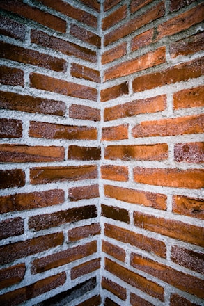 brown brick wall during daytime