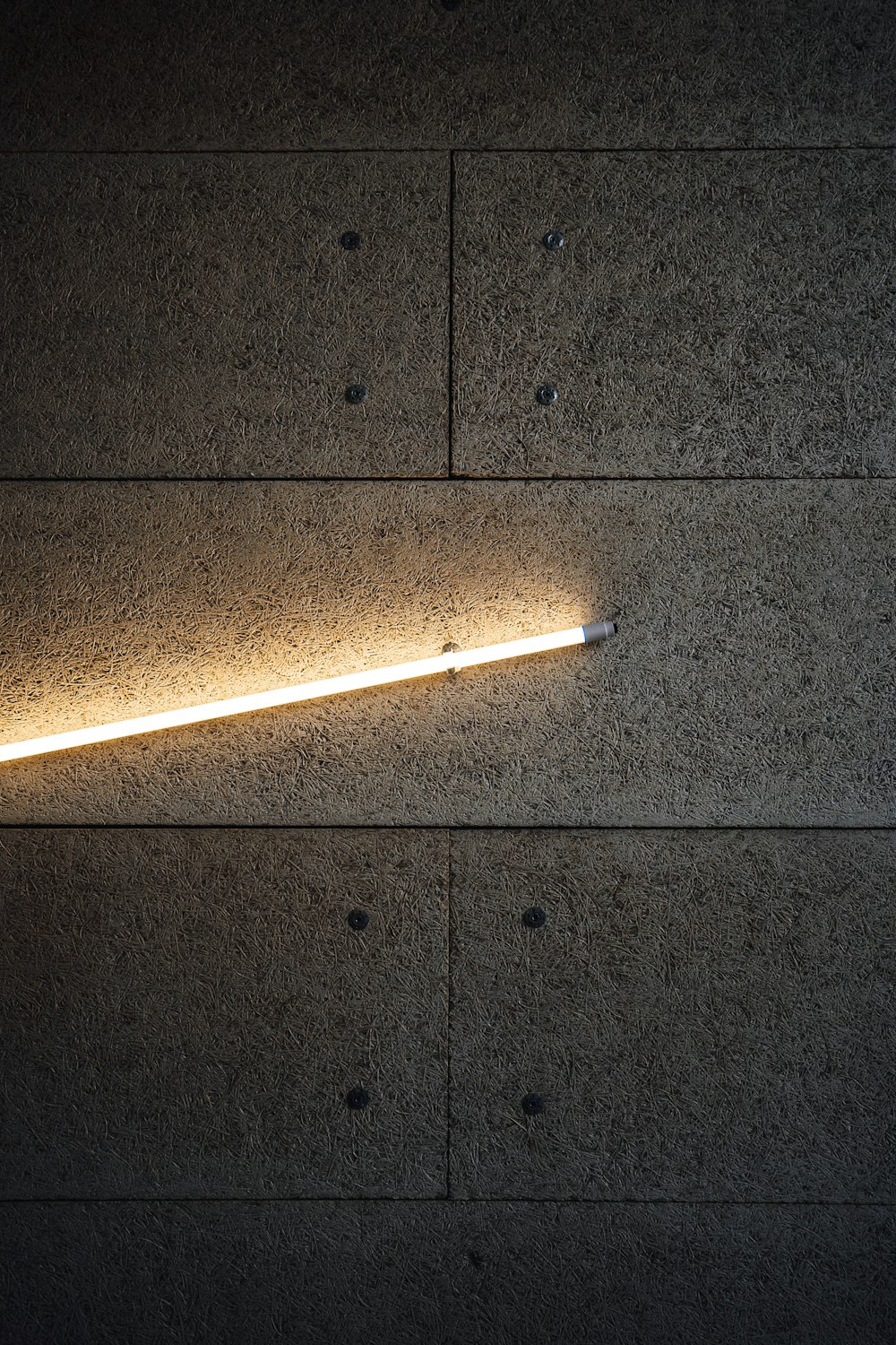 white and brown cigarette stick on black floor tiles