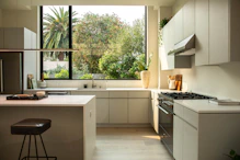 modern kitchen with island and large window