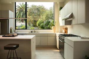 modern kitchen with island and large window