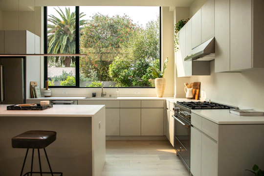 A bright modern kitchen featuring clean lines and integrated appliances.