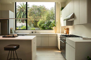 modern kitchen with island and large window
