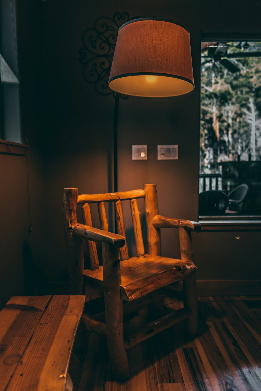 brown wooden armchair beside brown wooden table