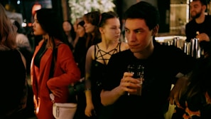 A diverse group of people socializing in a stylish lounge setting