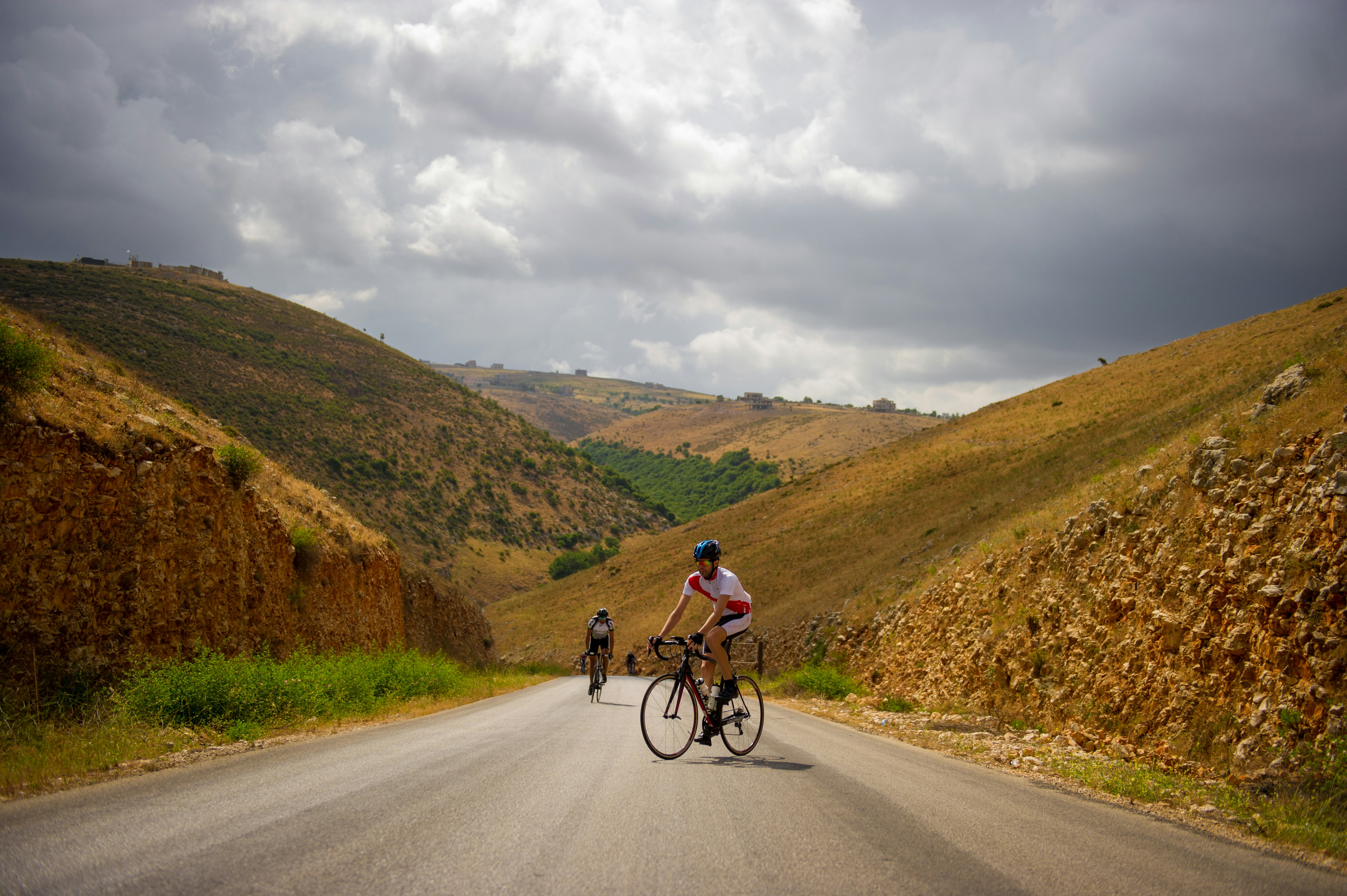 man riding bicycle on road during daytime