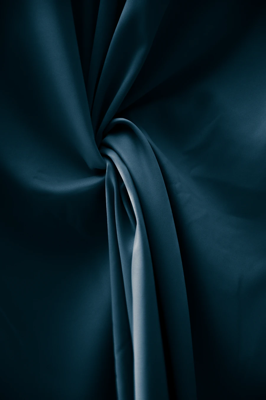 Dark blue silk fabric draped in a twist, Italy