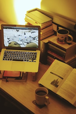 macbook pro on brown wooden table