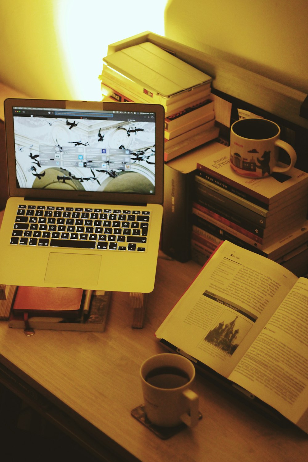 macbook pro on brown wooden table