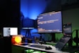 black flat screen computer monitor on green desk
