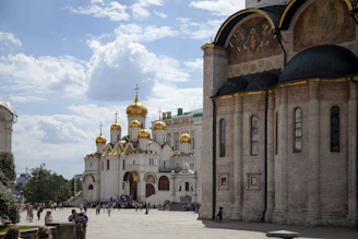 A friendly guide sharing stories with travelers at the vibrant Zenkov Cathedral.