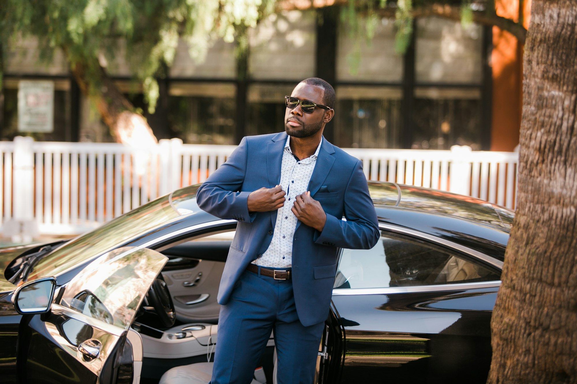 Corporate client inspecting a luxury car
